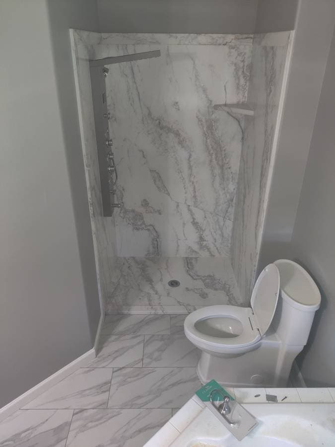 picture of a newly remodeled luxury bathroom shower and floors