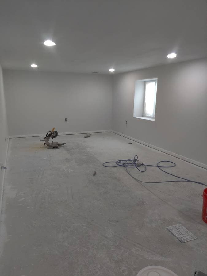 picture of a newly remodeled bathroom with custom red led lighting
