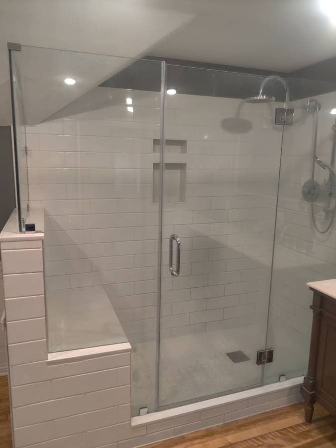 picture of a remodeled luxury shower with custom glass doors