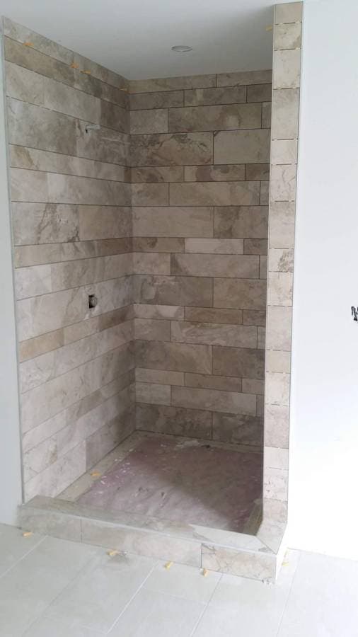 picture of a living room fire place with custom stones