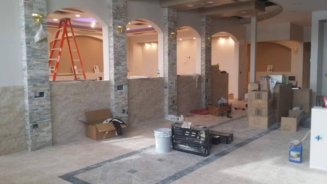 picture of a commercial remodel consisting of a new tile floor work